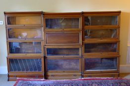 An early 20th century mahogany Globe Wernicke triple stacking bookcase With line inlaid detailing,