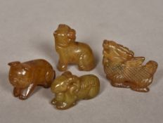 Four Chinese carved hardstone animals Comprising: a mythical beast, a tiger, a pig and a ram.