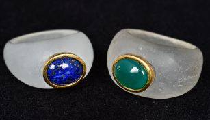 A cabochon jade set ring Together with a cabochon lapis lazuli ring en suite.