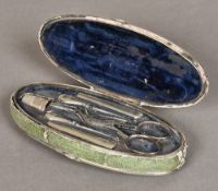 A George III white metal mounted shagreen covered etui Of oval form,