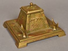 An Art Nouveau pressed brass inkwell Of