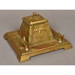 An Art Nouveau pressed brass inkwell Of