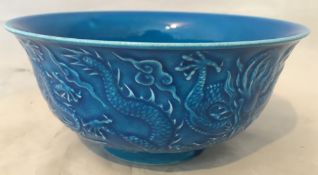 A Chinese porcelain bowl Moulded with d
