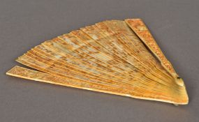 A 19th century Chinese carved ivory fan