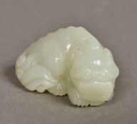 A Chinese carved celadon jade temple lio