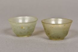 A pair of small jade tea bowls Each of