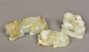 A Chinese carved celadon and russet jade