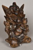A Chinese carved wood mask Grotesque ca