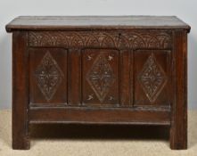 A 18th century carved oak three panel co