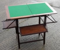 An Edwardian drop flap card table