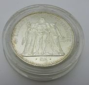 An uncirculated French silver 10 Franc coin,