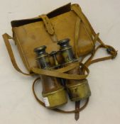A cased pair of military binoculars