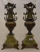A pair of spelter and onyx urns