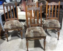 A set of four Victorian carved walnut dining chairs