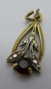 A 9 ct gold garnet set pendant