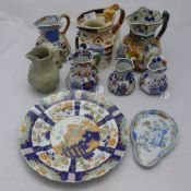 A collection of Masons Ironstone jugs and plates
