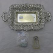 A silver plated bon bon dish with filigree work together with a silver top cut glass perfume bottle