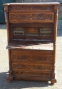 A 19th century Continental carved walnut secretaire chest of drawers