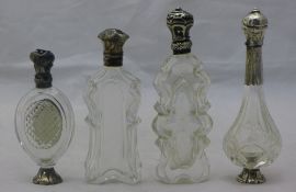 Four silver top scent bottles