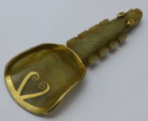 A gilt decorated jade spoon