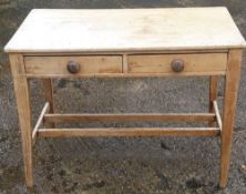 A Victorian pine two drawer side table