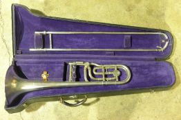 A cased Frank Holton Symphony trombone