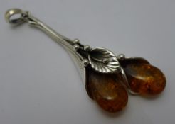 An Art Nouveau style amber dress pendant