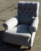 A Victorian upholstered button back armchair