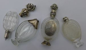 Four silver topped scent bottles