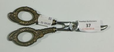 A pair of silver handled grape scissors