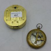 Two brass compasses