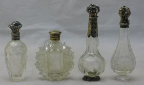 Four silver top scent bottles