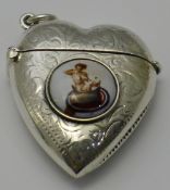 A silver vesta in the form of a heart