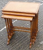 A nest of satinwood tables