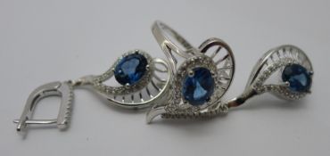 A suite of jewellery comprising: a pair of earrings and a ring