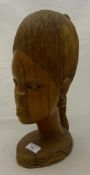 A carved African female bust