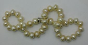 A string of large white pearls