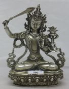 A silvered bronze figure of a deity