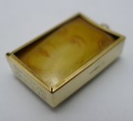 A 9 ct gold cased ten shilling note pendant/charm