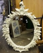 A cream floral framed mirror