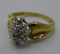 A 10 K gold and diamond cluster ring