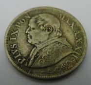 A silver Vatican coin,