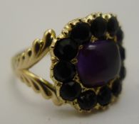 A Georgian 18 ct gold jet and amethyst ring