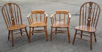 Two elm seated smokers bow armchairs