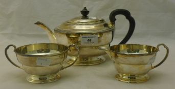 A three piece silver tea set