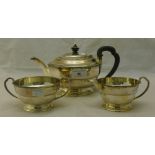 A three piece silver tea set