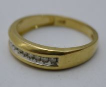 A 14 ct gold twelve stone diamond ring