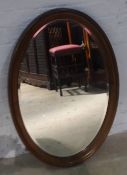 An early 20th century walnut framed mirror