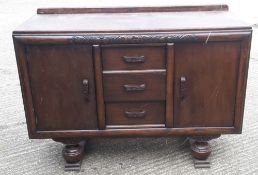 An early 20th century oak sideboard