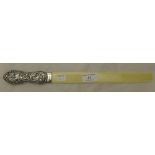 A silver handled ivory letter opener